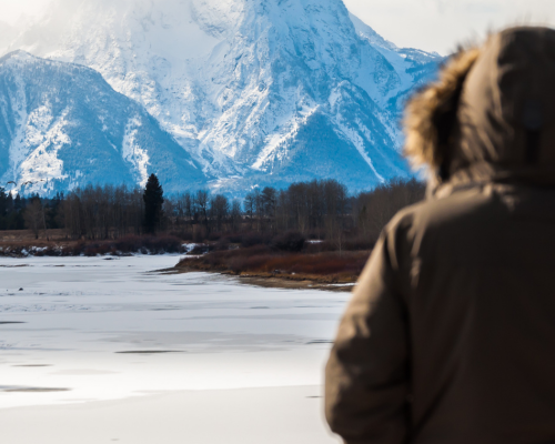 Tourists marveling at vast Majestic Tetons in winter